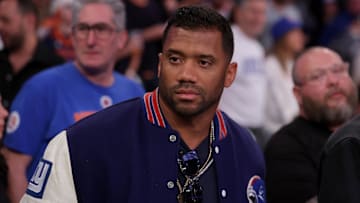 May 16, 2025; New York, New York, USA; New York Giants quarterback Russell Wilson stands courtside during the fourth quarter of game six in the second round of the 2025 NBA Playoffs between the New York Knicks and the Boston Celtics at Madison Square Garden. Mandatory Credit: Brad Penner-Imagn Images