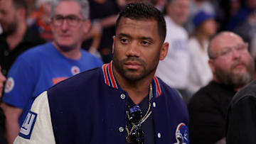 May 16, 2025; New York, New York, USA; New York Giants quarterback Russell Wilson stands courtside during the fourth quarter of game six in the second round of the 2025 NBA Playoffs between the New York Knicks and the Boston Celtics at Madison Square Garden. Mandatory Credit: Brad Penner-Imagn Images