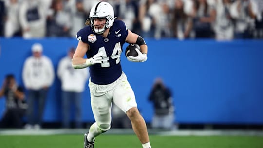 Dec 31, 2024; Glendale, AZ, USA; Penn State Nittany Lions tight end Tyler Warren (44) runs after a catch against the Boise State Broncos during the first half in the Fiesta Bowl at State Farm Stadium. Mandatory Credit: Mark J. Rebilas-Imagn Images