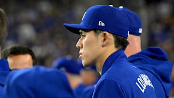Mar 31, 2025; Los Angeles, California, USA; Los Angeles Dodgers pitcher Roki Sasaki (11) in the dugout during the third inning against the Atlanta Braves at Dodger Stadium. Mandatory Credit: Jayne Kamin-Oncea-Imagn Images