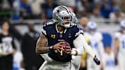 Dallas Cowboys quarterback Dak Prescott rolls out during the first half against the Detroit Lions at Ford Field. 