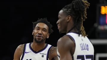 Feb 13, 2024; Phoenix, Arizona, USA; Sacramento Kings guard Malik Monk (0) and Sacramento Kings guard Keon Ellis (23) talk against the Phoenix Suns in the first half at Footprint Center. Mandatory Credit: Rick Scuteri-Imagn Images