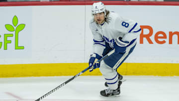 Jan 25, 2025; Ottawa, Ontario, CAN; Toronto Maple Leafs deenseman Christopher Tanev (8) skates with the puck against the Ottawa Senators in the third period at the Canadian Tire Centre. Mandatory Credit: Marc DesRosiers-Imagn Images