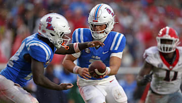 Nov 9, 2024; Oxford, Mississippi, USA; Mississippi Rebels quarterback Jaxson Dart (2) hands the ball off to running back Ulysses Bentley IV (24) during the first half against the Georgia Bulldogs at Vaught-Hemingway Stadium. Mandatory Credit: Petre Thomas-Imagn Images