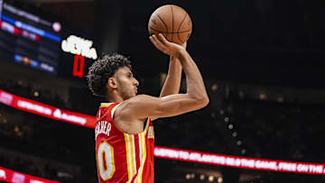 Nov 6, 2024; Atlanta, Georgia, USA; Atlanta Hawks forward Zaccharie Risacher (10) shoots against the New York Knicks during the second half at State Farm Arena. Mandatory Credit: Dale Zanine-Imagn Images