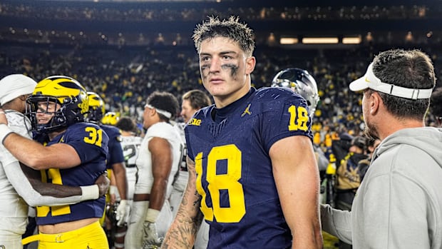 Michigan tight end Colston Loveland (18) walks off the field after 38-17 loss to Oregon at Michigan Stadium in Ann Arbor on S