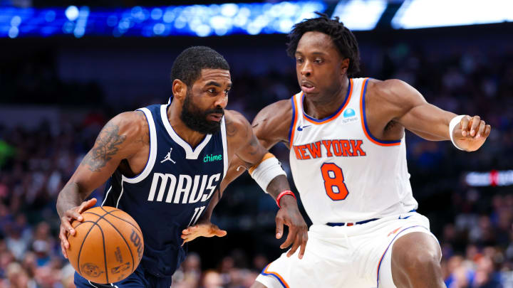 Jan 11, 2024; Dallas, Texas, USA;  Dallas Mavericks guard Kyrie Irving (11) drives to the basket as New York Knicks forward OG Anunoby (8) defends during the second half at American Airlines Center. Mandatory Credit: Kevin Jairaj-USA TODAY Sports