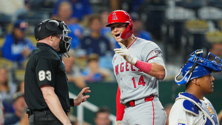 Aug 21, 2024; Kansas City, Missouri, USA; Los Angeles Angels catcher Logan O'Hoppe (14) talks with umpire Mike Estabrook (83) during the ninth inning against the Kansas City Royals at Kauffman Stadium. Mandatory Credit: Jay Biggerstaff-USA TODAY Sports