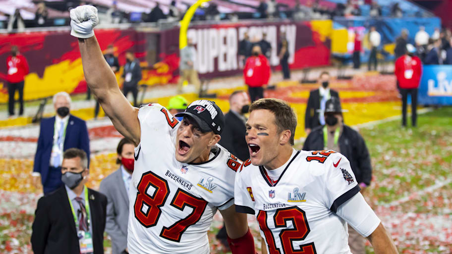 Feb 7, 2021; Tampa, FL, USA;  Tampa Bay Buccaneers quarterback Tom Brady (12) and tight end Rob Gronkowski (87) celebrate after beating the Kansas City Chiefs in Super Bowl LV at Raymond James Stadium.  Mandatory Credit: Mark J. Rebilas-Imagn Images | Mark J. Rebilas-Imagn Images