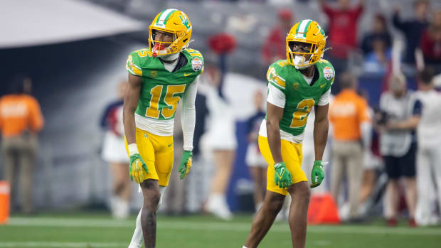 Oregon Ducks wide receiver Gary Bryant Jr. (2) and Tez Johnson (15) against the Liberty Flames during the 2024 Fiesta Bowl.