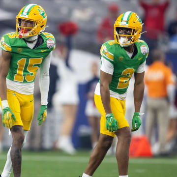 Jan 1, 2024; Glendale, AZ, USA; Oregon Ducks wide receiver Gary Bryant Jr. (2) and Tez Johnson (15) against the Liberty Flames during the 2024 Fiesta Bowl at State Farm Stadium. Mandatory Credit: Mark J. Rebilas-USA TODAY Sports