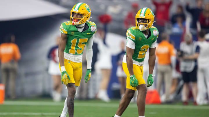 Jan 1, 2024; Glendale, AZ, USA; Oregon Ducks wide receiver Gary Bryant Jr. (2) and Tez Johnson (15) against the Liberty Flames during the 2024 Fiesta Bowl at State Farm Stadium. Mandatory Credit: Mark J. Rebilas-USA TODAY Sports