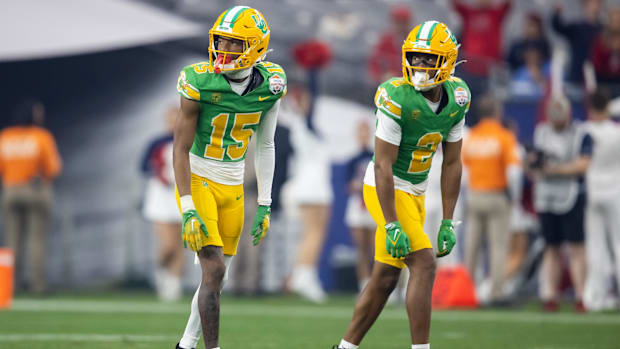 Oregon Ducks wide receiver Gary Bryant Jr. (2) and Tez Johnson (15) against the Liberty Flames during the 2024 Fiesta Bowl at
