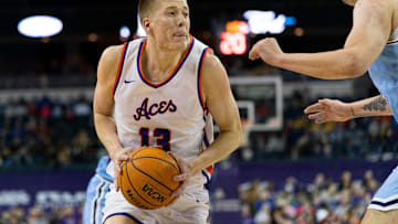 Evansville   s Ben Humrichous (13) drives as the University of Evansville Purple Aces play the Indiana State Sycamores at Ford Center in Evansville, Ind., Wednesday, Feb. 28, 2024.