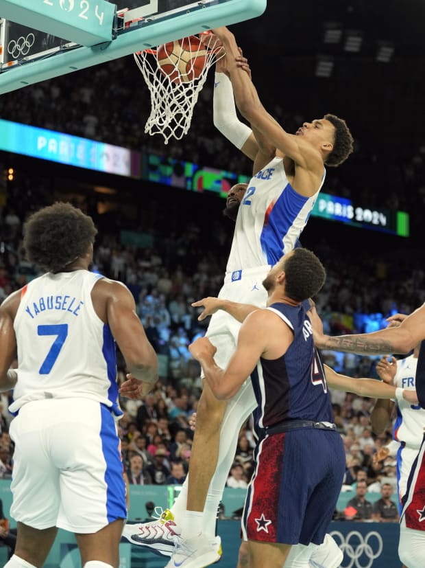 France power forward Victor Wembanyama (32) shoots against the United States in the second half. 