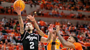 Nov 9, 2025; Stillwater, Oklahoma, USA; Texas A&M Aggies guard Pop Isaacs (2) shoots the ball during the second half against the Oklahoma State Cowboys at Gallagher-Iba Arena. Mandatory Credit: William Purnell-Imagn Images