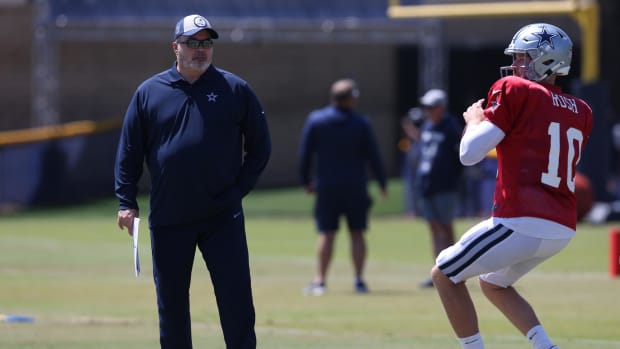  Dallas Cowboys head coach Mike McCarthy watches quarterback Cooper Rush (10) throw during training camp