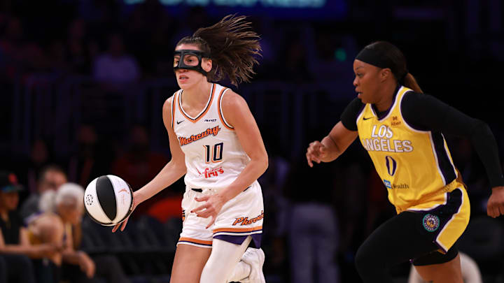 Jun 1, 2025; Los Angeles, California, USA;  Phoenix Mercury guard Sevgi Uzun (10) dribbles the ball against Los Angeles Sparks guard Odyssey Sims (0) during the first quarter at Crypto.com Arena. Mandatory Credit: Kiyoshi Mio-Imagn Images