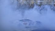 May 4, 2025; Fort Worth, Texas, USA; NASCAR Cup Series driver Joey Logano (22) performs a burnout as he celebrates winning the Wurth 400 race at Texas Motor Speedway. Mandatory Credit: Jerome Miron-Imagn Images