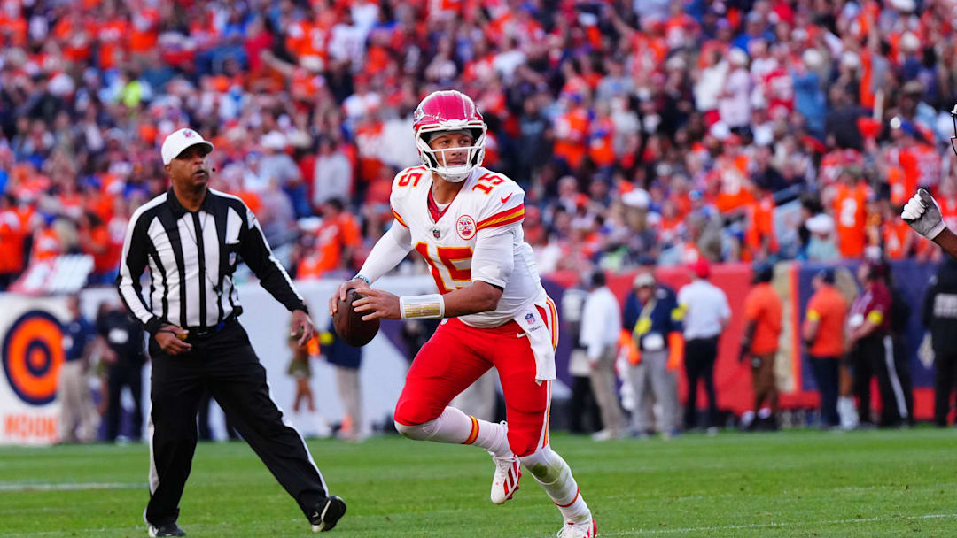 Nov 16, 2025; Denver, Colorado, USA; Kansas City Chiefs quarterback Patrick Mahomes (15) scrambles in the second quarter against the Denver Broncos at Empower Field at Mile High. Mandatory Credit: Ron Chenoy-Imagn Images