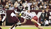 Nov 16, 2024; College Station, Texas, USA; New Mexico State Aggies linebacker Tyler Martinez (35) defends in coverage as Texas A&M Aggies offensive lineman Dametrious Crownover (78) blocks during the second half at Kyle Field. Mandatory Credit: Maria Lysaker-Imagn Images 