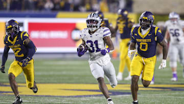 Oct 19, 2024; Morgantown, West Virginia, USA; Kansas State Wildcats running back DJ Giddens (31) runs after a catch during the third quarter against the West Virginia Mountaineers at Mountaineer Field at Milan Puskar Stadium. Mandatory Credit: Ben Queen-Imagn Images