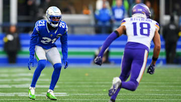 Nov 30, 2025; Seattle, Washington, USA; Seattle Seahawks cornerback Devon Witherspoon (21) prepares for the play against Minnesota Vikings wide receiver Justin Jefferson (18) during the second half at Lumen Field.