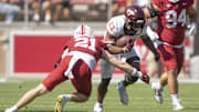 Oct 5, 2024; Stanford, California, USA;  Virginia Tech Hokies running back Bhayshul Tuten (33) runs with the football against Stanford Cardinal safety Scotty Edwards (21) during the second quarter at Stanford Stadium. Mandatory Credit: Stan Szeto-Imagn Images
