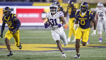 Oct 19, 2024; Morgantown, West Virginia, USA; Kansas State Wildcats running back DJ Giddens (31) runs after a catch during the third quarter against the West Virginia Mountaineers at Mountaineer Field at Milan Puskar Stadium. Mandatory Credit: Ben Queen-Imagn Images