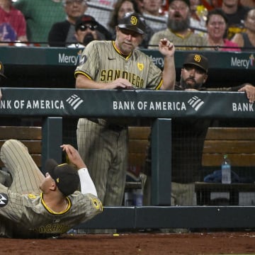 Aug 28, 2024; St. Louis, Missouri, USA;  San Diego Padres third baseman Manny Machado (13) dives and catches a foul ball hit by St. Louis Cardinals second baseman Brendan Donovan (not pictured) during the eighth inning at Busch Stadium. Mandatory Credit: Jeff Curry-USA TODAY Sports