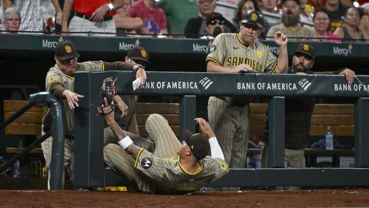 Aug 28, 2024; St. Louis, Missouri, USA;  San Diego Padres third baseman Manny Machado (13) dives and catches a foul ball hit by St. Louis Cardinals second baseman Brendan Donovan (not pictured) during the eighth inning at Busch Stadium. Mandatory Credit: Jeff Curry-USA TODAY Sports