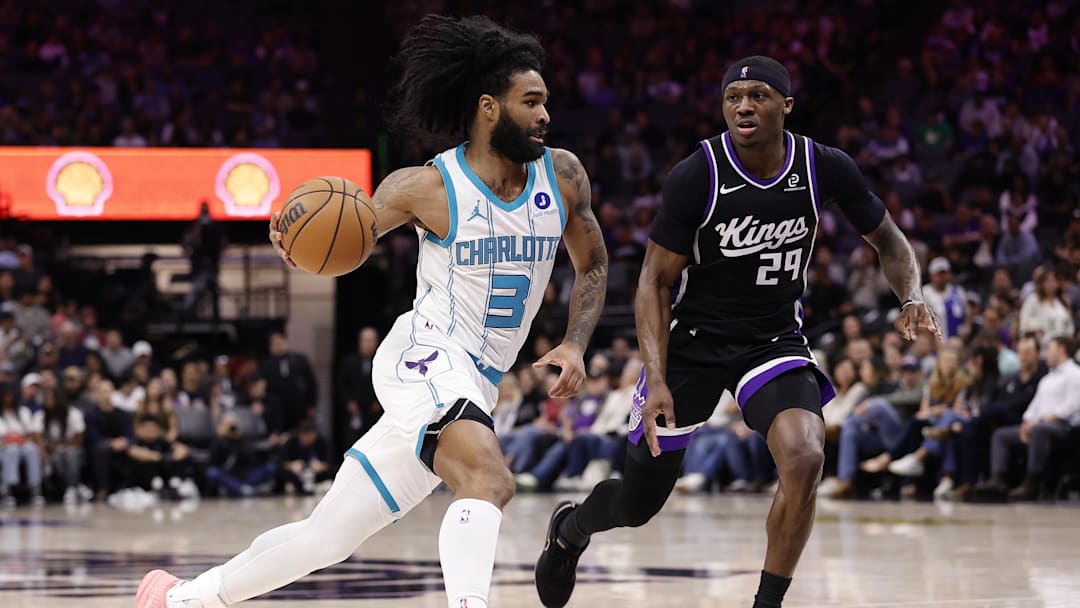 Mar 11, 2026; Sacramento, California, USA; Charlotte Hornets guard Coby White (3) drives in against Sacramento Kings forward/guard Daeqwon Plowden (29) during the fourth quarter at Golden 1 Center. Mandatory Credit: Kelley L Cox-Imagn Images
