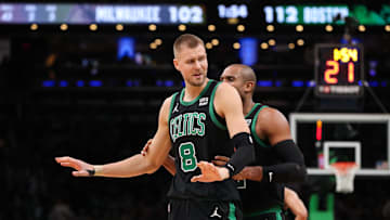 Boston Celtics center Kristaps Porzingis reacts after getting a technical foul during the second half against the Milwaukee Bucks at TD Garden
