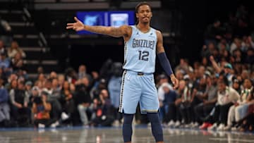 Nov 29, 2024; Memphis, Tennessee, USA; Memphis Grizzlies guard Ja Morant (12) reacts during the first quarter against the New Orleans Pelicans at FedExForum. Mandatory Credit: Petre Thomas-Imagn Images