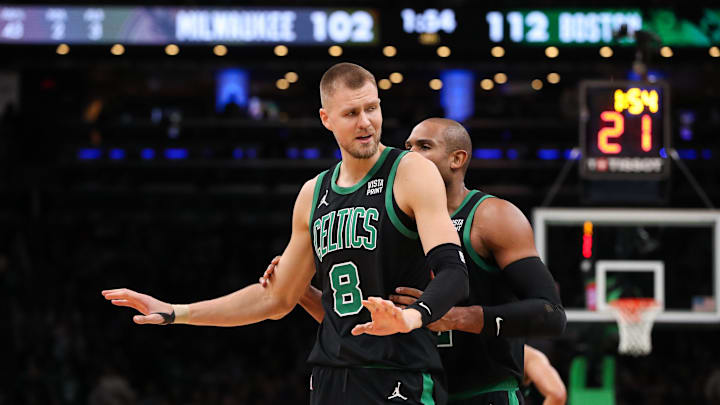 Boston Celtics center Kristaps Porzingis reacts after getting a technical foul during the second half against the Milwaukee Bucks at TD Garden