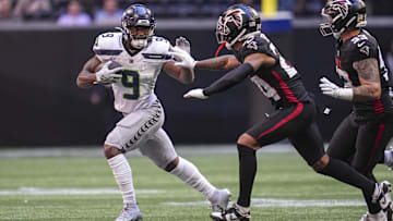 Oct 20, 2024; Atlanta, Georgia, USA; Seattle Seahawks running back Kenneth Walker III (9) runs against Atlanta Falcons cornerback A.J. Terrell (24) during the first quarter at Mercedes-Benz Stadium. Mandatory Credit: Dale Zanine-Imagn Images