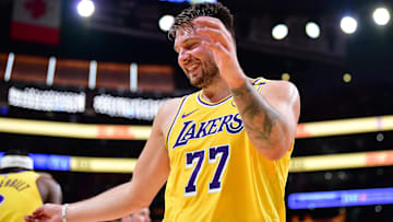 Mar 4, 2025; Los Angeles, California, USA; Los Angeles Lakers guard Luka Doncic (77) reacts after scoring a basket and drawing the foul against the New Orleans Pelicans during the first half at Crypto.com Arena. Mandatory Credit: Gary A. Vasquez-Imagn Images