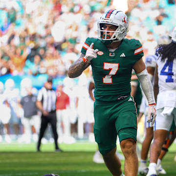 Nov 2, 2024; Miami Gardens, Florida, USA; Miami Hurricanes wide receiver Xavier Restrepo (7) celebrates after scoring a touchdown against the Duke Blue Devils during the third quarter at Hard Rock Stadium. Mandatory Credit: Sam Navarro-Imagn Images