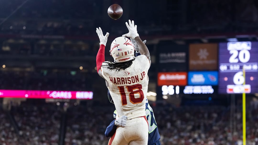 Sep 25, 2025; Glendale, Arizona, USA; Arizona Cardinals wide receiver Marvin Harrison Jr. (18) catches a pass for a touchdown against the Seattle Seahawks at State Farm Stadium. 