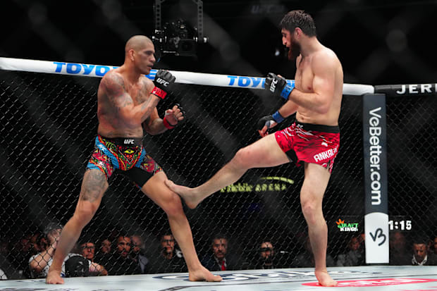 Alex Pereira (red gloves) fights Magomed Ankalaev (blue gloves) during UFC 313 at T-Mobile Arena. 