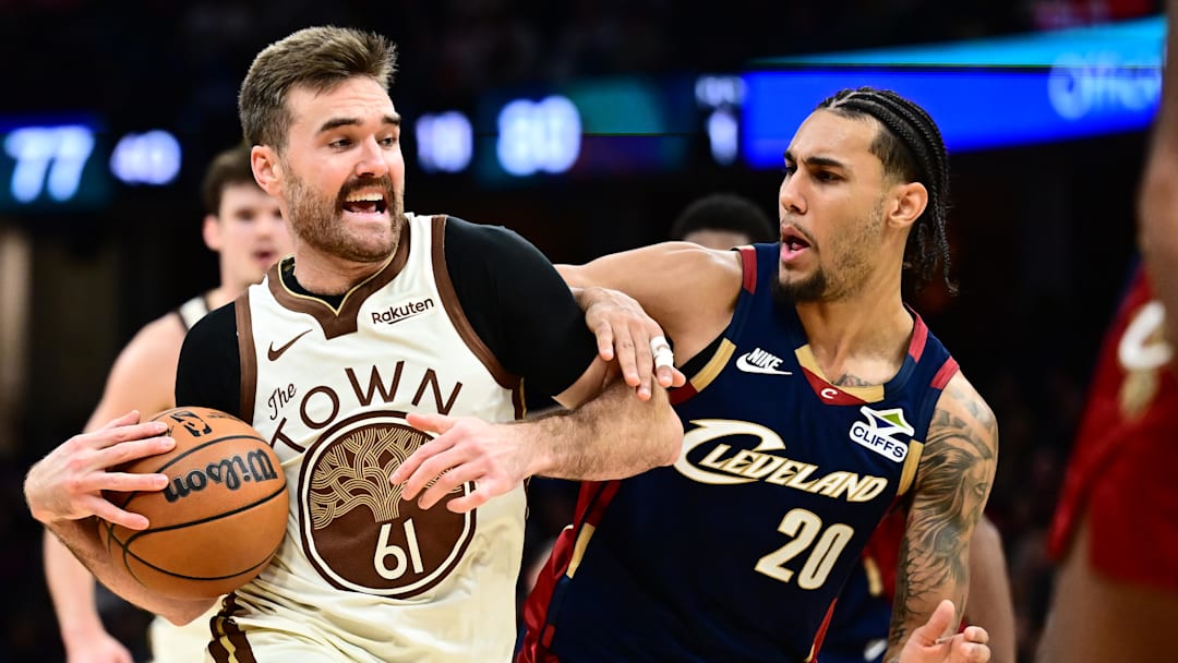 Dec 6, 2025; Cleveland, Ohio, USA; Golden State Warriors guard Pat Spencer (61) drives to the basket against Cleveland Cavaliers guard Jaylon Tyson (20) during the second half at Rocket Arena. Mandatory Credit: Ken Blaze-Imagn Images