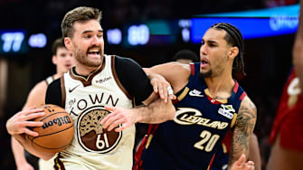 Dec 6, 2025; Cleveland, Ohio, USA; Golden State Warriors guard Pat Spencer (61) drives to the basket against Cleveland Cavaliers guard Jaylon Tyson (20) during the second half at Rocket Arena. Mandatory Credit: Ken Blaze-Imagn Images