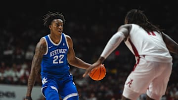 Feb 22, 2025; Tuscaloosa, Alabama, USA; Kentucky Wildcats center Amari Williams (22) drives the ball against Alabama Crimson Tide center Clifford Omoruyi (11) during the second half at Coleman Coliseum. Mandatory Credit: Will McLelland-Imagn Images
