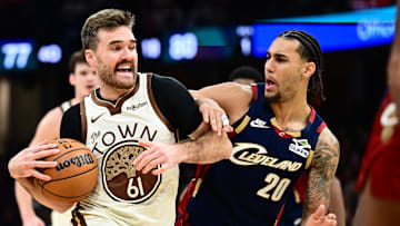 Dec 6, 2025; Cleveland, Ohio, USA; Golden State Warriors guard Pat Spencer (61) drives to the basket against Cleveland Cavaliers guard Jaylon Tyson (20) during the second half at Rocket Arena. Mandatory Credit: Ken Blaze-Imagn Images