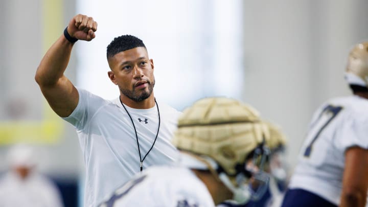 Notre Dame head coach Marcus Freeman warms up during a Notre Dame football practice at Irish Athletic Center on Thursday, Aug. 15, 2024, in South Bend.