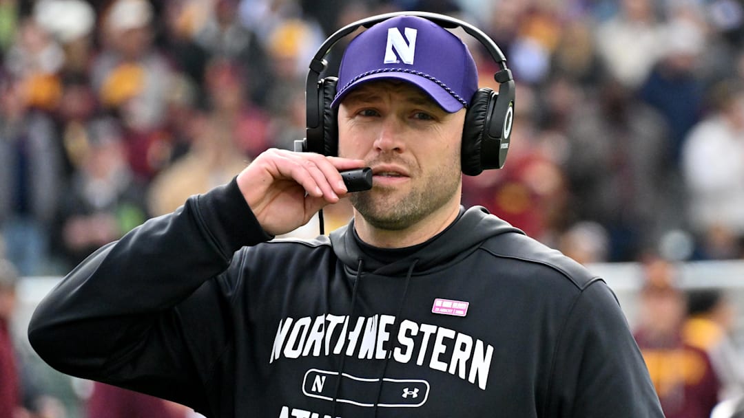 Nov 22, 2025; Chicago, Illinois, USA; Northwestern Wildcats head coach David Braun is seen against the Minnesota Golden Gophers during the first half at Wrigley Field. Nov 22, 2025; Chicago, Illinois, USA; Northwestern Wildcats head coach David Braun is seen against the Minnesota Golden Gophers during the first half at Wrigley Field.