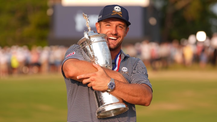 Jun 16, 2024; Pinehurst, North Carolina, USA; Bryson DeChambeau celebrates with the trophy after winning the U.S. Open golf tournament. Mandatory Credit: Jim Dedmon-USA TODAY Sports Jun 16, 2024; Pinehurst, North Carolina, USA; Bryson DeChambeau celebrates with the trophy after winning the U.S. Open golf tournament. Mandatory Credit: Jim Dedmon-USA TODAY Sports