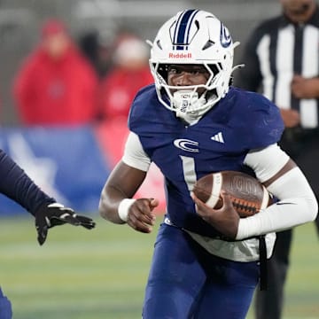 Dec 5, 2025; Birmingham, AL, USA; Clay-Chalkville's Aaron Frye (1) runs the ball during the game with Saraland at Protective Life Stadium in the AHSAA 6A State Championship game.