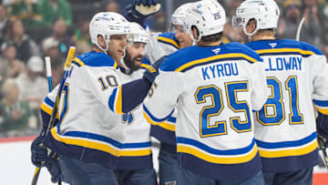 Mar 15, 2025; Saint Paul, Minnesota, USA; St. Louis Blues center Brayden Schenn (10) is congratulated by teammates after scoring on the Minnesota Wild in the first period at Xcel Energy Center. Mandatory Credit: Matt Blewett-Imagn Images