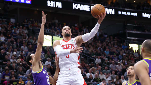 Houston Rockets forward Dillon Brooks (9) lays the ball up against Utah Jazz forward Darius Bazley (21) during the fourth qua